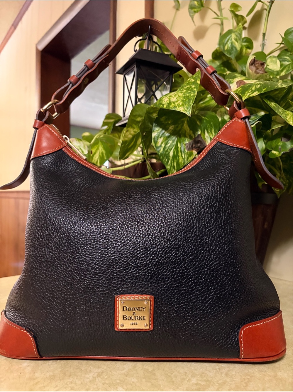 Dooney & Bourke Black Pebbled Leather Bag with Gold Plaque